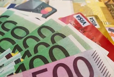 Spread of euro banknotes and credit cards — showcasing Binance’s easy fiat on-ramps with Visa etc