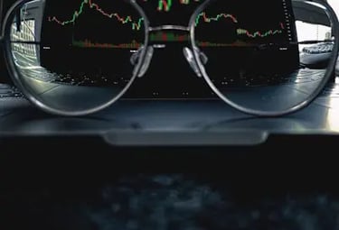 Glasses with crypto chart showing best value for traders and investors