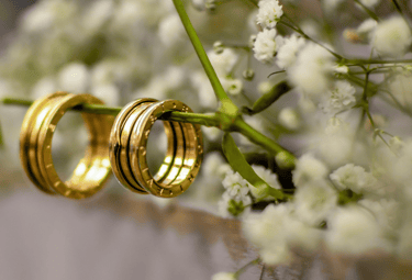 two wedding rings with wedding rings on them
