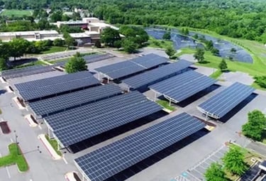 Aerial view of a commercial solar panel carport installation providing renewable energy and shade.