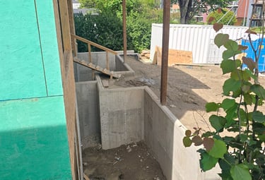 Site preparation and structural work including excavation, foundation, and framing.