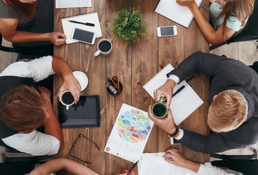a group of people sitting around a table