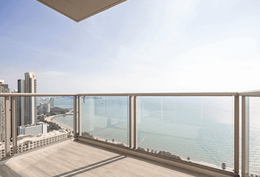 a balcony with a balcony with a view of the ocean