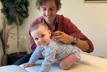 Young baby gettting a specific adjustment to the vagus nerve to help her calm and regulate