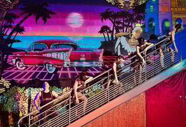 Les artistes de La Troupe du BaréKa interprètent une chorégraphie sur une rampe colorée.