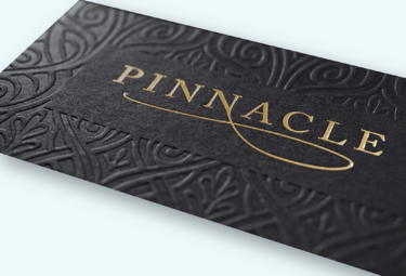 a business card with a gold foil foil stamping on it