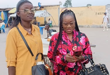 two women standing next to each other in a street