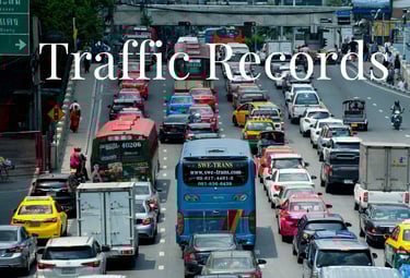 a bus is driving down a busy street - KamBri Solutions