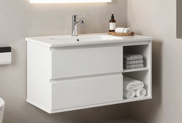 Technician inspecting paint equipment parts in a workshop with red and black accents.