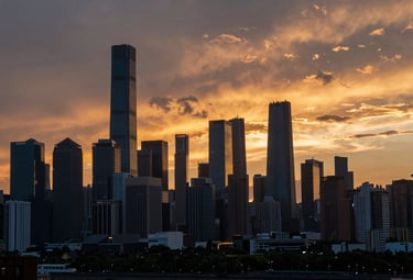 A cinematic landscape shot of a sunset over a modern urban skyline, graded with deep Slate Steel shadows and vibrant Burnished Gold highlights, evocative of a high-budget film production.