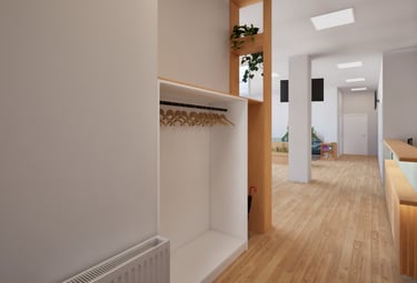 Eingangsbereich einer modernen Praxis mit Garderobe und hellem Flur.