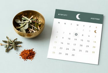A flat lay of organic Ayurvedic herbs, a brass bowl, and a lunar calendar, photographed in a clean, minimalist style with #F0F5F7 as the background and #5D7E8C accents.