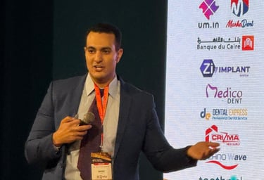 a man in a suit and tie is giving a presentation