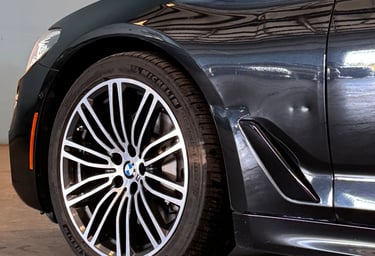 BMW fender damage. Aluminium panel