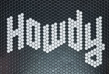 Black and white mosaic tiles with the word howdy in the design