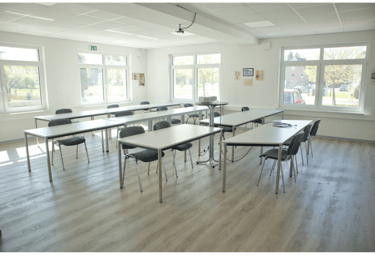 a room with a table and chairs and a table Paderborn