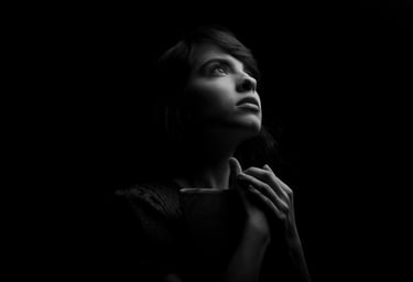 Woman seeking calm spiritual guidance and emotional support during a difficult experience