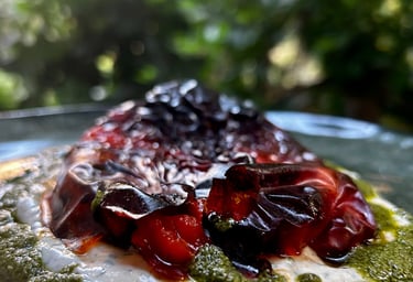 a plate of food with a green and red sauce