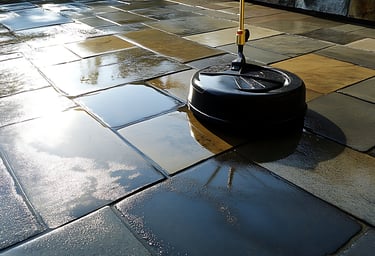 Professional paver cleaning with surface cleaner on wet natural stone patio in Sarasota, Florida