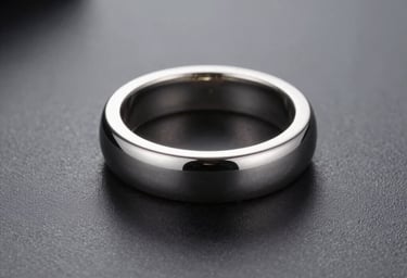 Professional commercial photograph of high-end jewelry on a dark gray reflective surface, minimalist composition, crisp details, soft dramatic lighting from the side, tones of black and light gray, International Professional style.