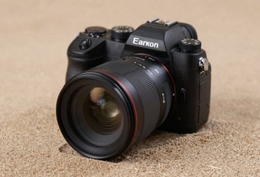 A close-up of professional camera equipment resting on a textured Soft Sand fabric. The lighting is soft and cinematic, highlighting the glass of the lens. Authentic lifestyle photography gear shot.