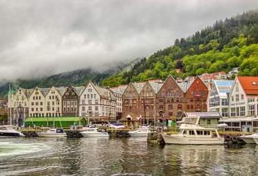 Boats and houses on coast of Bergen , Norway