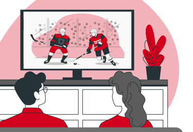 a couple sitting on a couch watching streaming sports game on their large screen TV