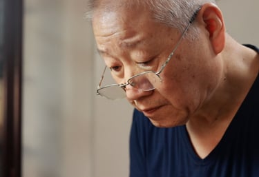 Artisan Kuai Liangrong crafting a teapot