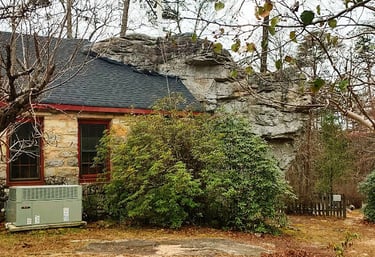 Mentone, AL - The Rock Church has a boulder stuck to it's back wall