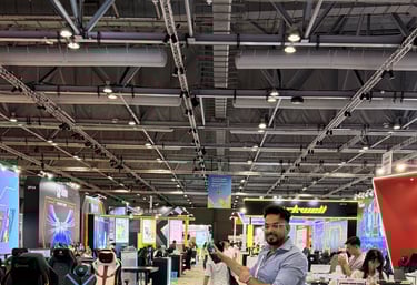 a man standing in a room with a video game controller  zoom in a bit 