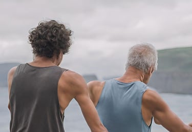Two men dancing on the beach together