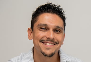 a male translator with a beard and a mustache on his face