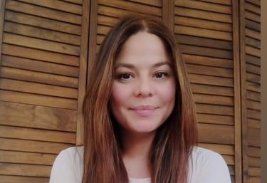 a woman with long hair and a white shirt
