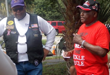 Sickle Cell Disease Association of EscaRosa: image of to African-American males speaking.