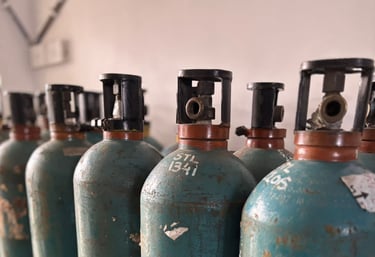 a row of gas bottles with a lot of gas