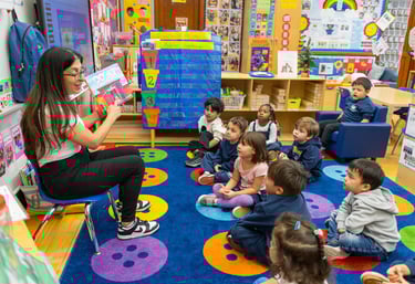 teacher reads aloud to class