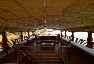 a boat with a table and chairs in the water