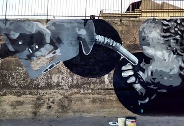 Monochrome mural depicting a child drinking from a fuel pump hose, a social awareness artwork create
