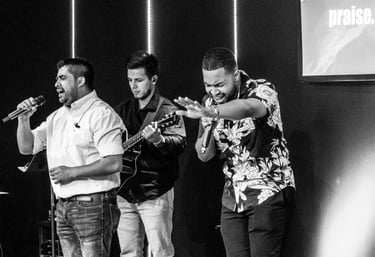 a group of men singing and playing instruments