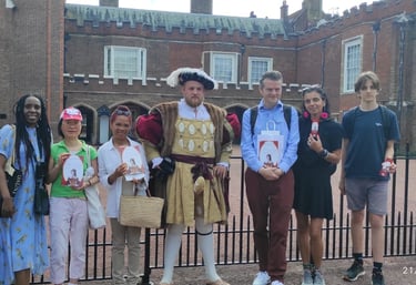 a group of people standing with Henry VIII