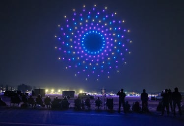 Futuristic yet amazing drone show forming a glowing wormhole effect in the night sky by SkyFiesta.