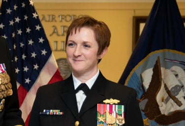 Commander Tetatzin receives the Meritorious Service Medal at her retirement ceremony in the Pentagon