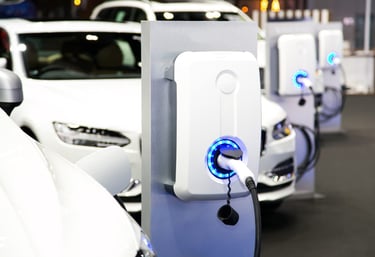 a row of electric cars parked in a row