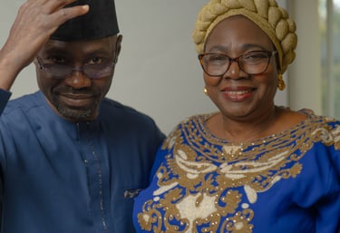 Older Nigerian couple dressed in elegant traditional attire, cultural portraits 