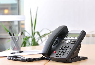 Desk phone used for VoIP calling in a professional office setting