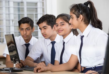 Computer Training, students learning in a digital classroom at Smart Village Computer. 