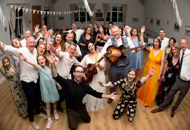 Wedding musicians having fun party with bride and groom