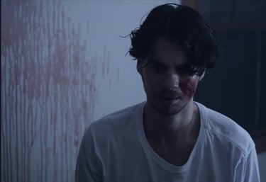 a man with a bloody face and a bloody face