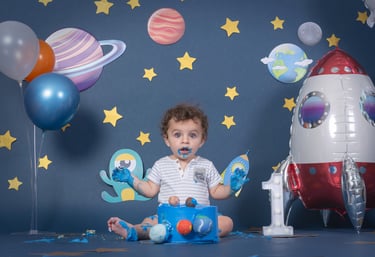 a baby boy in a space themed photo shoot