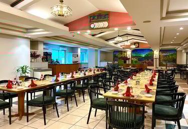 a restaurant with tables and chairs and a clock